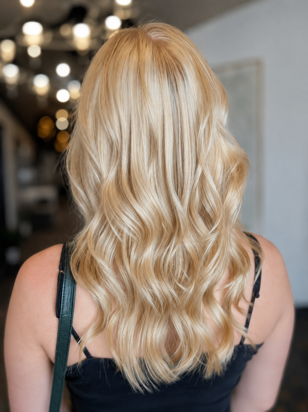 Soft blonde waves with bright dimensional blonding